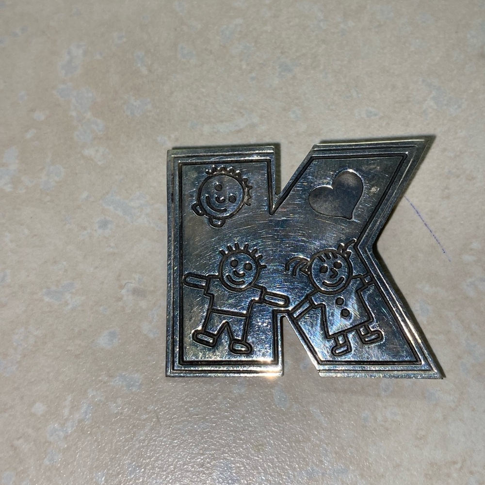 Sterling silver K brooch